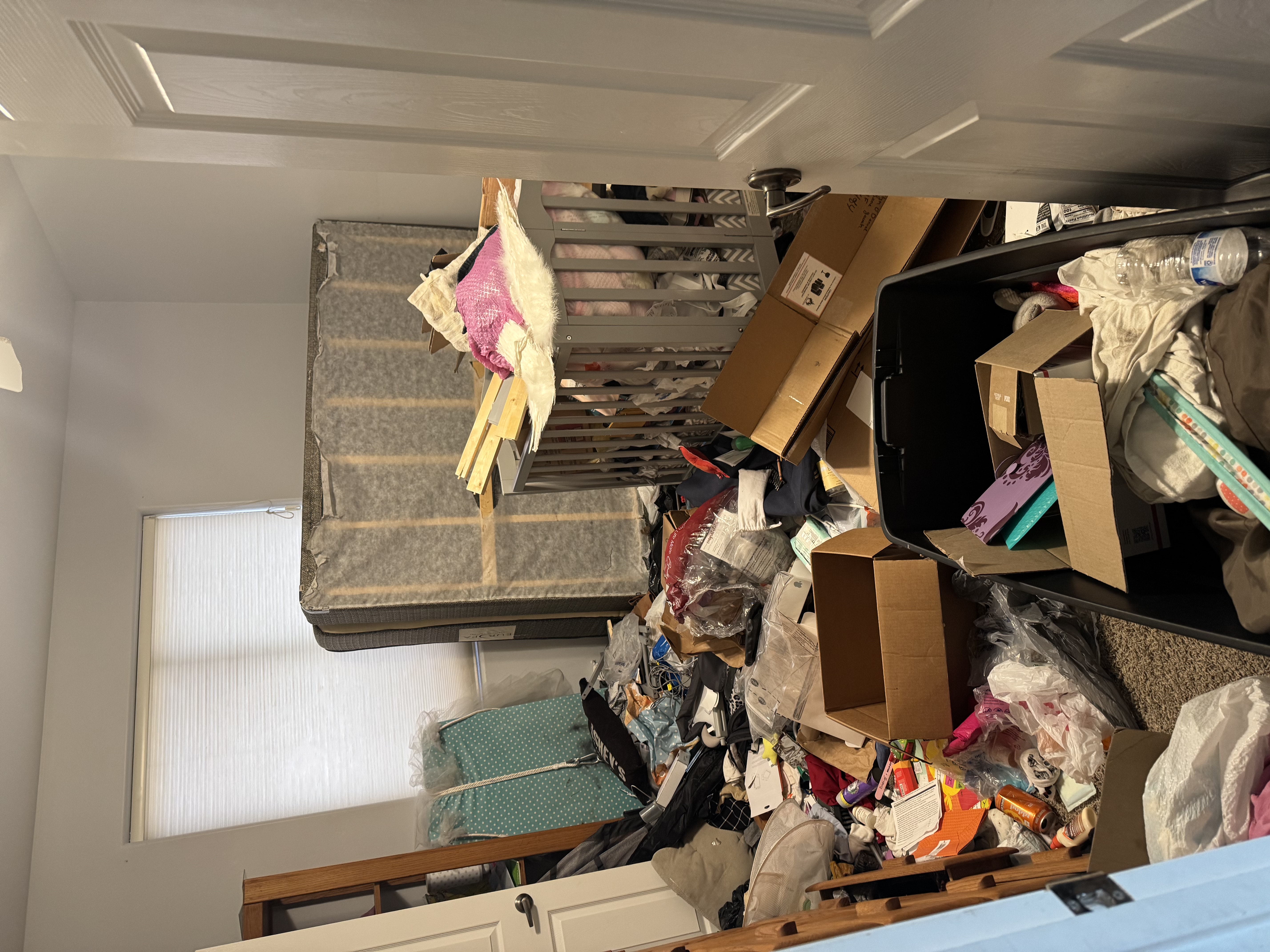 Cluttered estate interior before cleanout