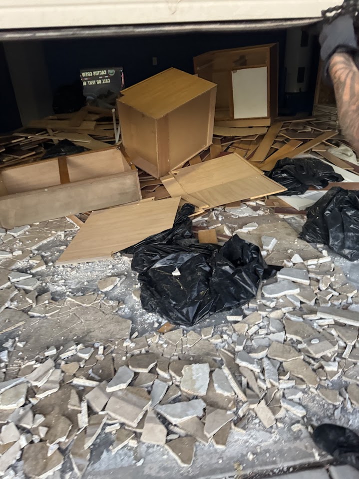 Cluttered garage before junk removal